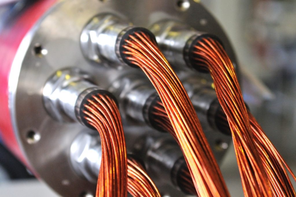 Close-up of a conductors of red copper wire in the kapton insulation. Electrical appliances and